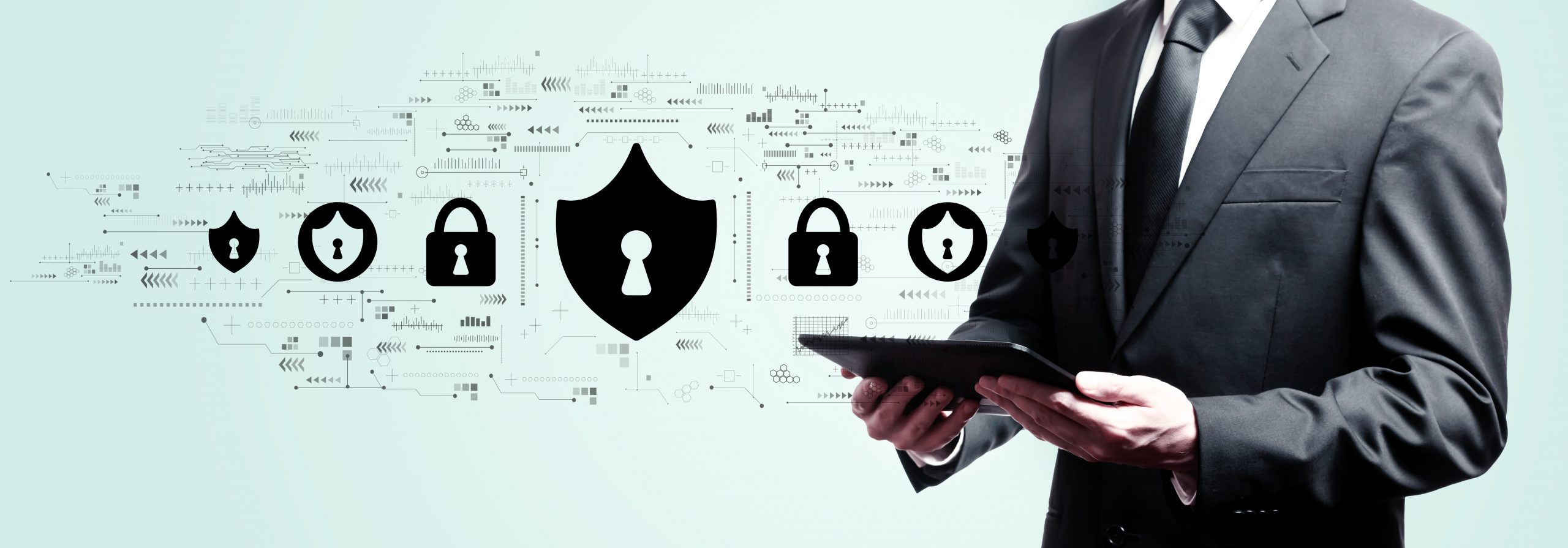 Cyber security theme with businessman holding a tablet